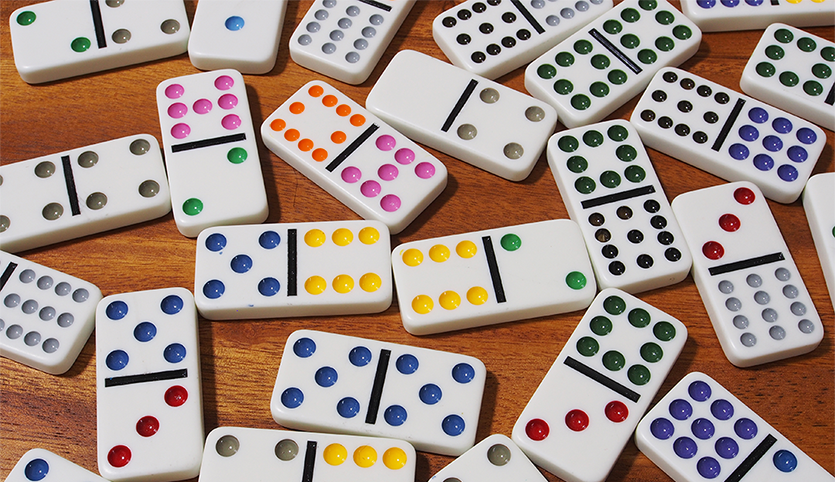 Dominoes game pieces on table